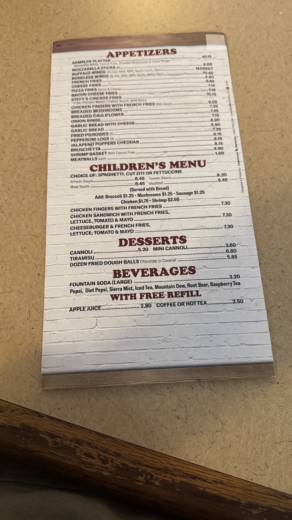 Restaurant menu listing pasta and children’s meals.